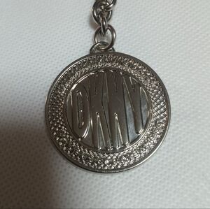 DKNY Metallic Silver Logo Keychain Bag Charm